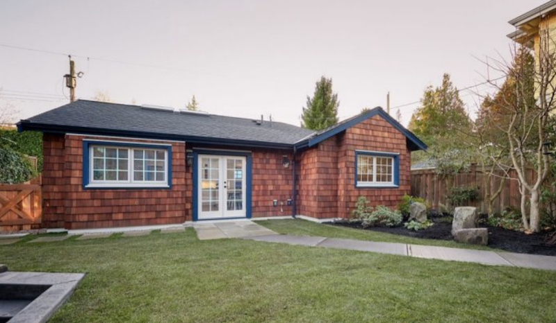 Brick house with a large front-yard.